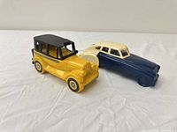 Two plastic Avon car-shaped after shave bottles