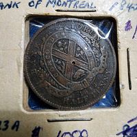 Obverse of 1842 half-penny token in cardboard flip