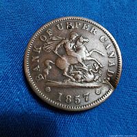 Obverse of 1857 Bank of Upper Canada token showing St. George and date