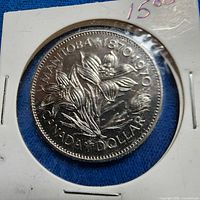 Reverse of coin showing prairie crocus with text MANITOBA 1870-1970 CANADA DOLLAR