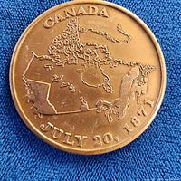 Obverse of token showing map of Canada and inscription