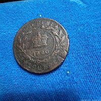 Reverse view showing crown, wreath, date 1880