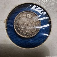 Reverse view of 1919 Canadian 10 cent coin in holder