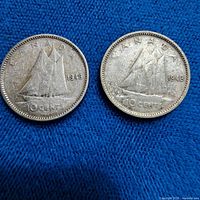 Both coins side by side, showing dates 1943 and 1949