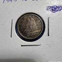 Reverse of 1943 Canadian 10¢ coin in holder