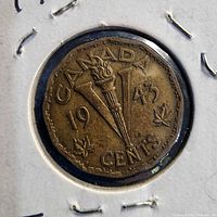 Full view of 1943 Canadian 5-cent coin in holder, showing design and date