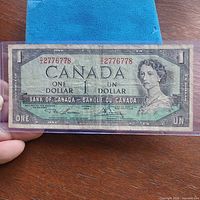 Front view of 1954 Bank of Canada one dollar note in sleeve