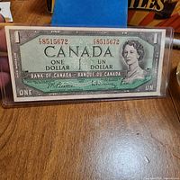 Front of 1954 one-dollar bill in sleeve