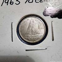 Reverse of 1963 Canadian 10-cent coin in holder