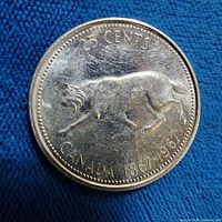 Reverse of 1967 Canadian quarter showing Bobcat and dates 1867-1967