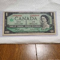 Full view of 1967 $1 note in sleeve