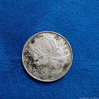 Reverse of 1968 Canadian quarter showing caribou and date