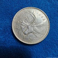 Reverse of 1968 Canadian 25-cent coin showing caribou and date