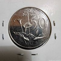 Reverse showing floral design and 50c denomination