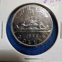 Full view of 1969 Canadian dollar in 2x2 holder