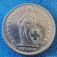 Obverse showing standing Helvetia with shield and stars