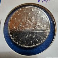 Obverse side of 1969 Canadian dollar in holder