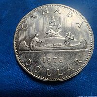 Reverse of 1978 Canadian dollar coin showing Voyageur design