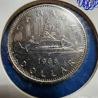 Reverse of 1986 Canada dollar showing Voyageur design