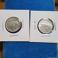 Two 1867-1967 Canadian quarters in holders
