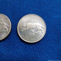 Both quarters front side showing bobcat design and dates