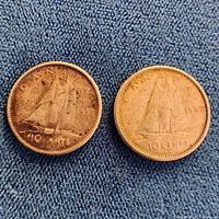 Front view of both dimes showing Bluenose schooner and dates 1958 and 1962