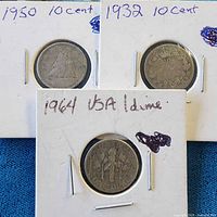 Group shot showing all three stapled coin flips labeled 1950, 1932, 1964