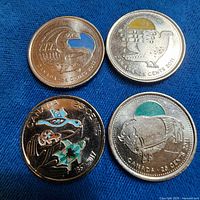 All four colourised Canadian quarters