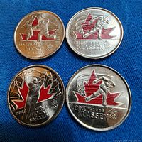 All four colourized Olympic 25-cent coins