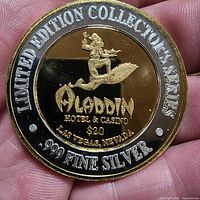 Obverse showing Aladdin on flying carpet, .999 fine silver, $20 value text