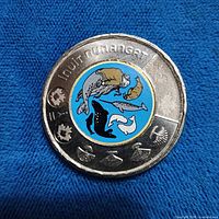 Reverse side showing coloured Inuit Nunangat wildlife design