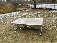 Full view of hammock mounted on steel stand on lawn
