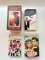 Front covers of all four VHS items arranged