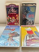 Front view of four VHS tapes showing titles and cover art