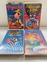 Front view of four VHS tapes showing cover art and titles