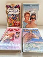 Front view of all four VHS tapes showing cover art