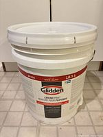 Full view of sealed 18.5 L Glidden ceiling paint bucket