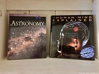 Front covers of both books standing upright