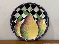 Front view of entire 17" ceramic platter showing pear motif and border