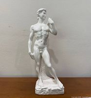 Front view of white glazed ceramic Michelangelo’s David statue