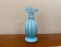 Full view of light blue overlay melon vase front