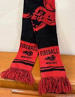 Full view of scarf draped to show length and both branded ends