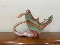Left profile of multicolour swan-form vase