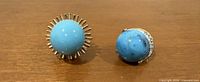 Front view showing both turquoise cabochon earrings