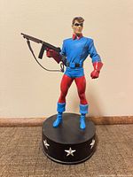 Front view of Bucky WWII Version statue on star-decorated base