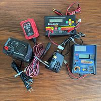 Group view of all chargers, leads and adapters on tabletop