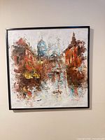 full view of framed abstract cityscape oil painting