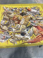 Overall view of chartreuse Hermès silk scarf with hunting motif