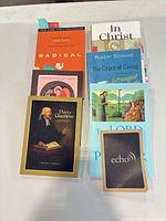 All books and Echo card laid out on table