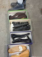 All five pairs of shoes lined vertically showing styles and colors